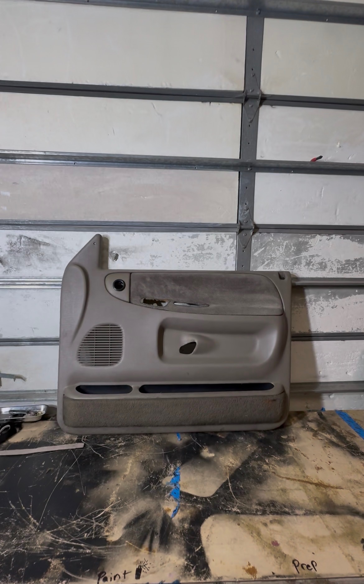 Original gray door panel before restoration