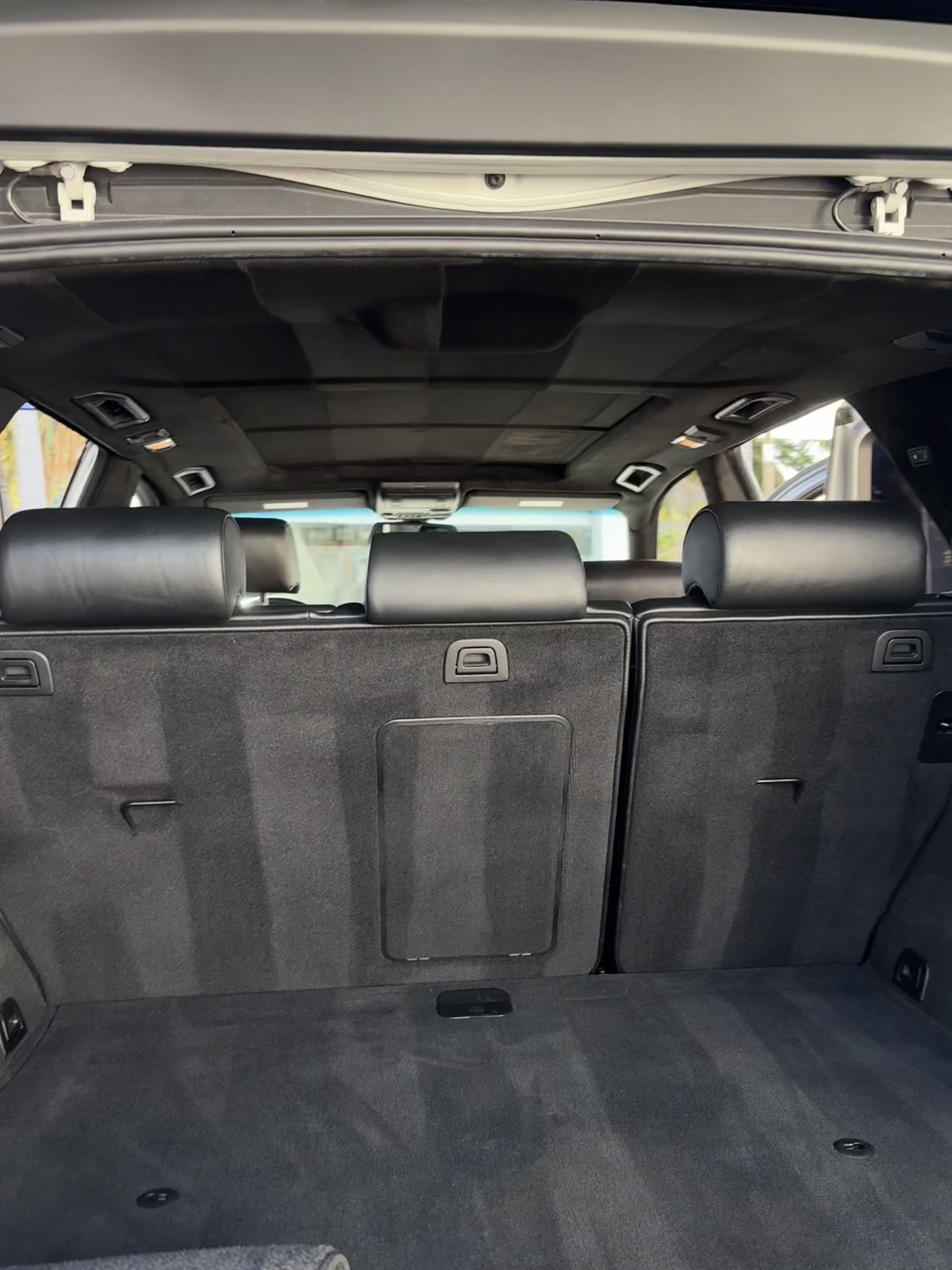 Completed black suede headliner restoration by Ethreal Customs