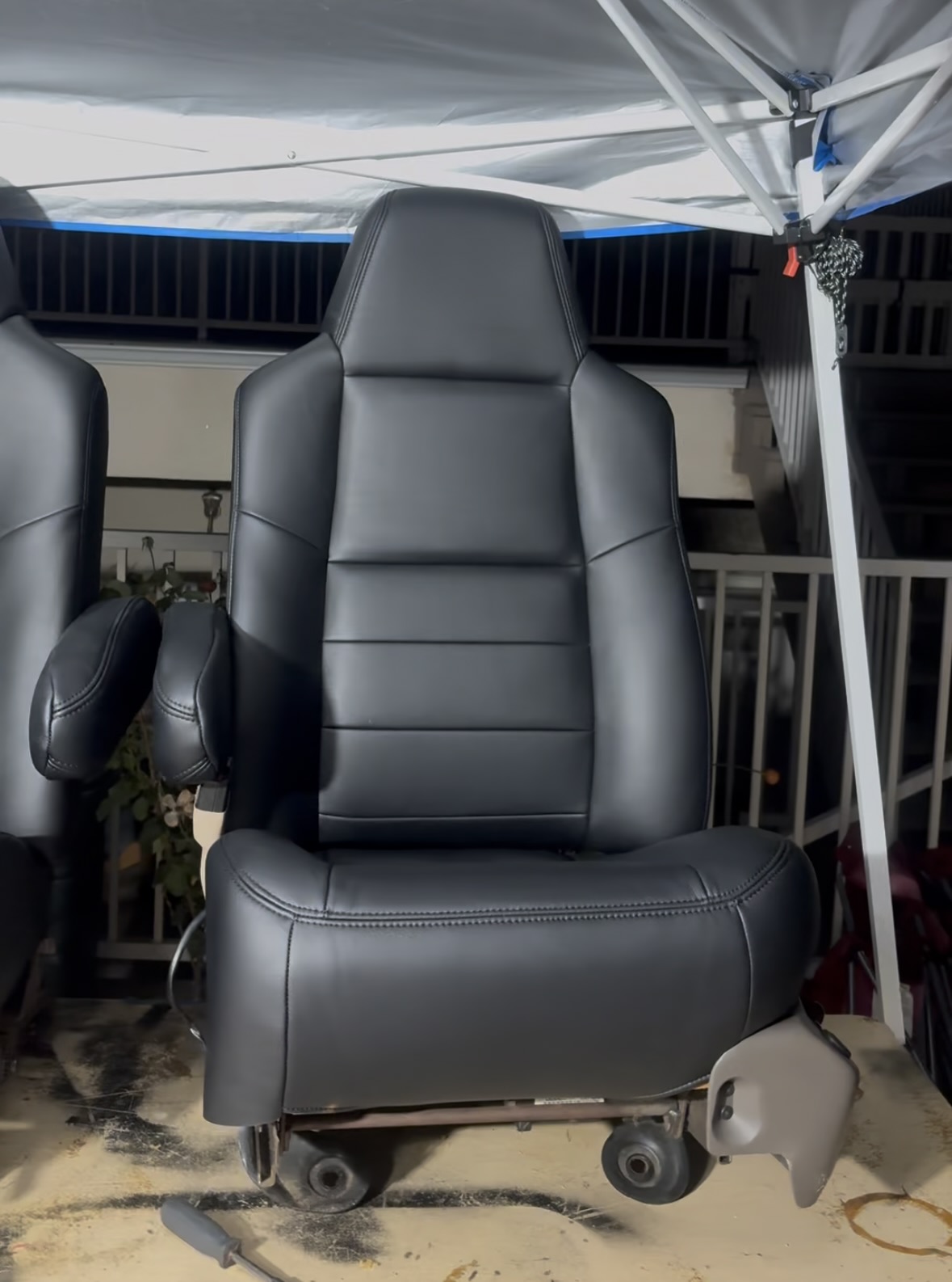 Restored black captain’s seat completed by Ethreal Customs