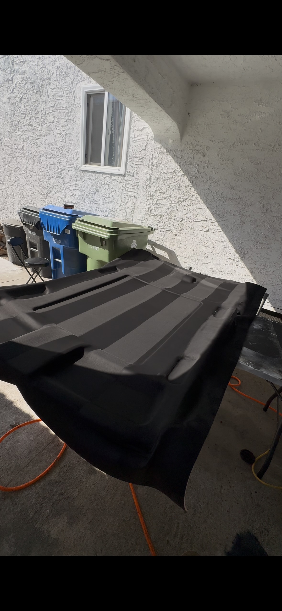Black automotive headliner installation by Ethreal Customs