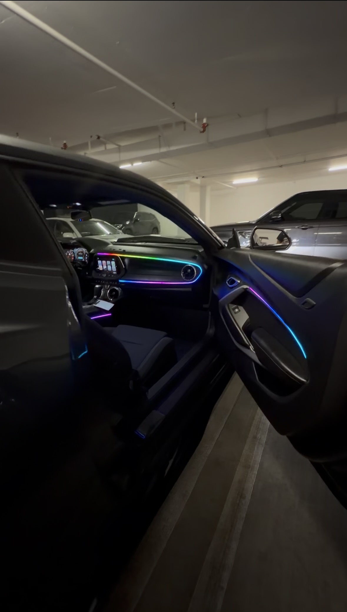 Multicolor automotive ambient lighting installed by Ethreal Customs